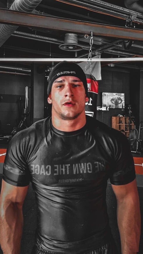 "WE OWN THE CAGE" RASHGUARD