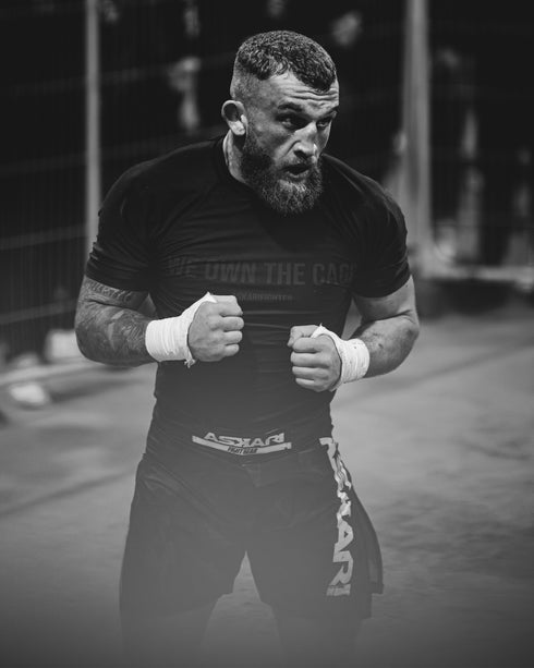 "WE OWN THE CAGE" RASHGUARD