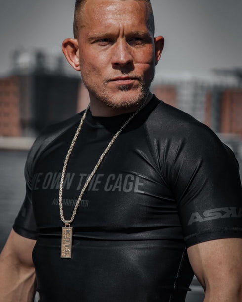 "WE OWN THE CAGE" RASHGUARD